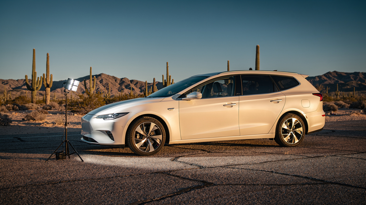 A hybrid car parked on hot asphalt in the Arizona desert